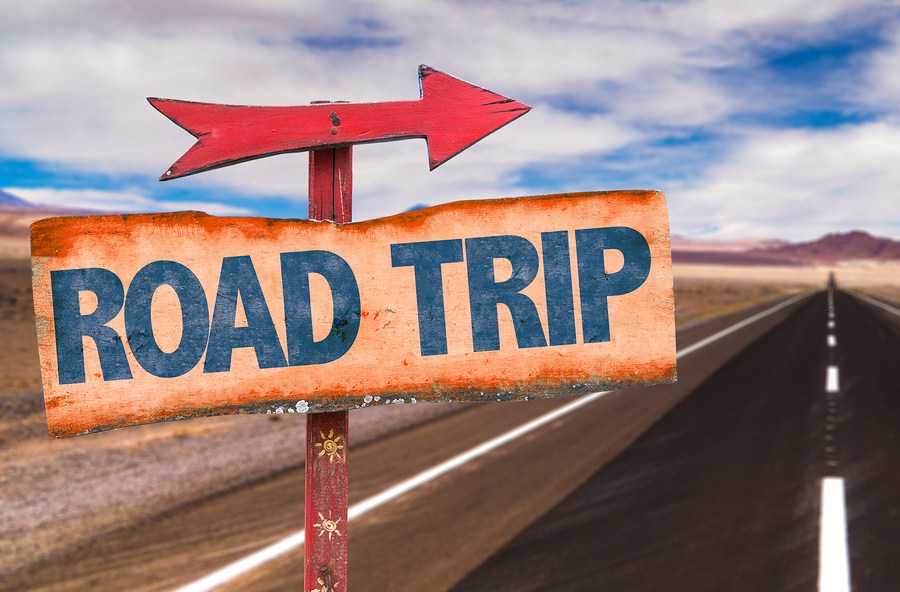 bigstock-road-trip-sign-with-road-backg-87933701